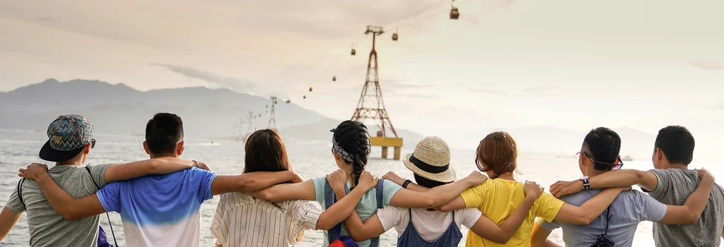 Diverse group of people putting hands together